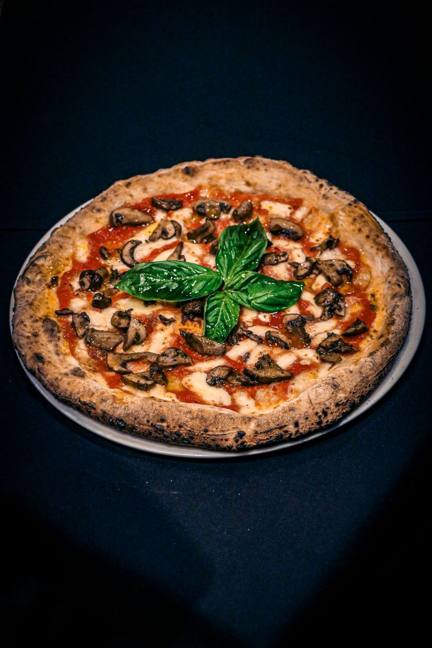 Pizza with mushrooms and basil