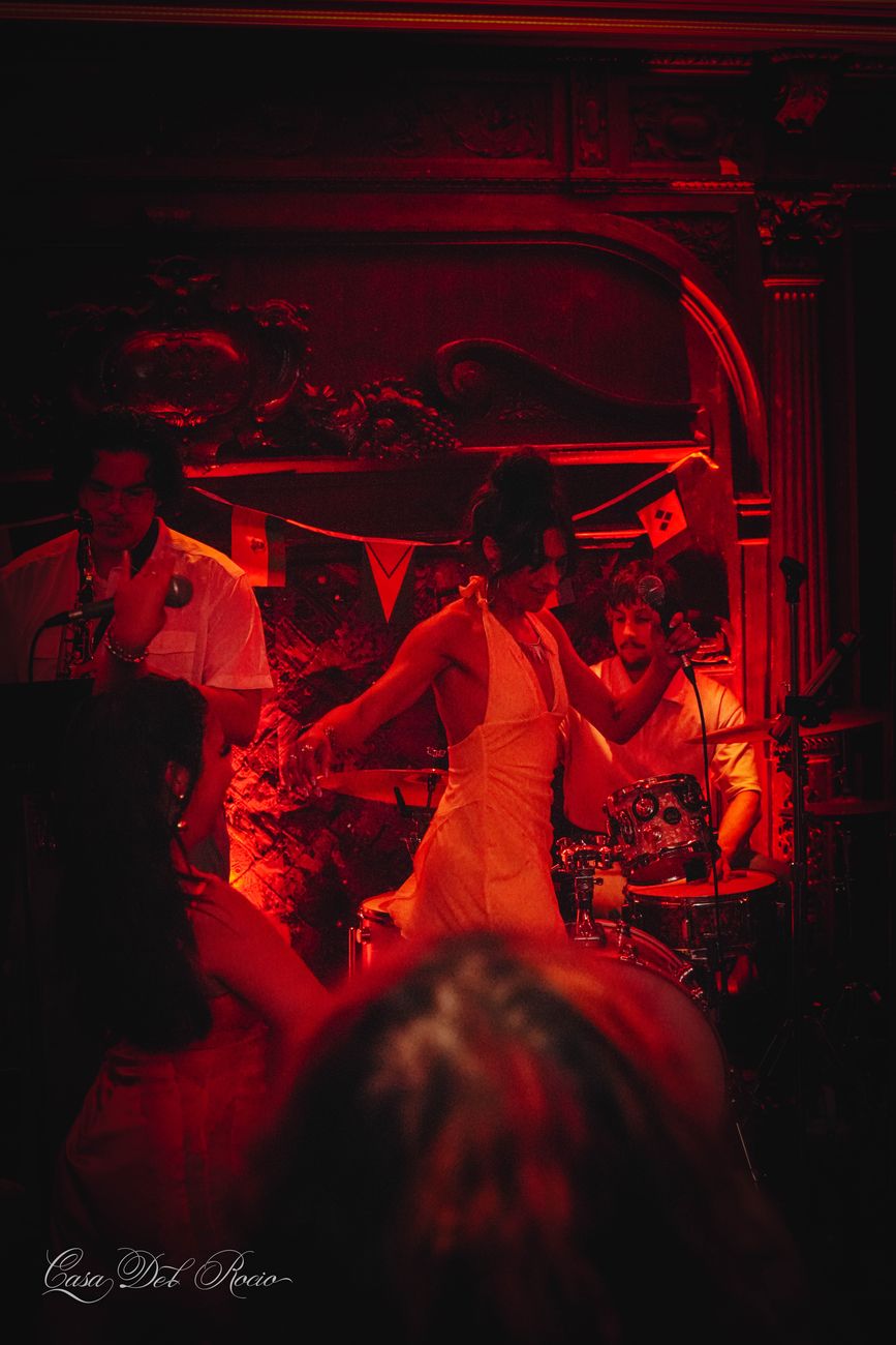 Dancers under red light