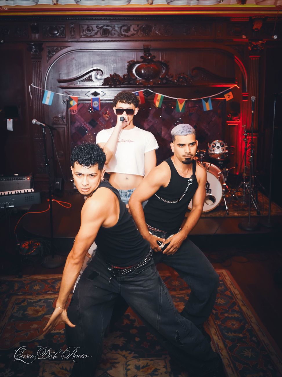 Performers posing on stage